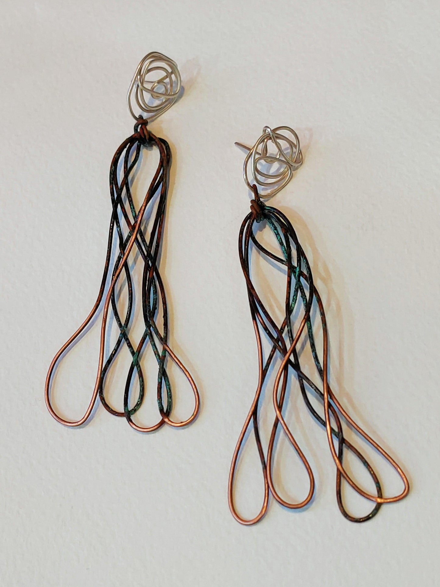 Copper and silver earrings. rust colors