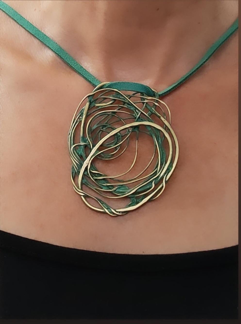 Bronze pendant with green patina
