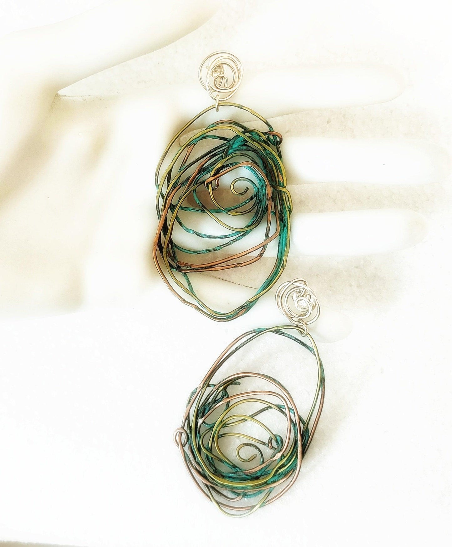 Bronze, copper and silver earrings with green patina