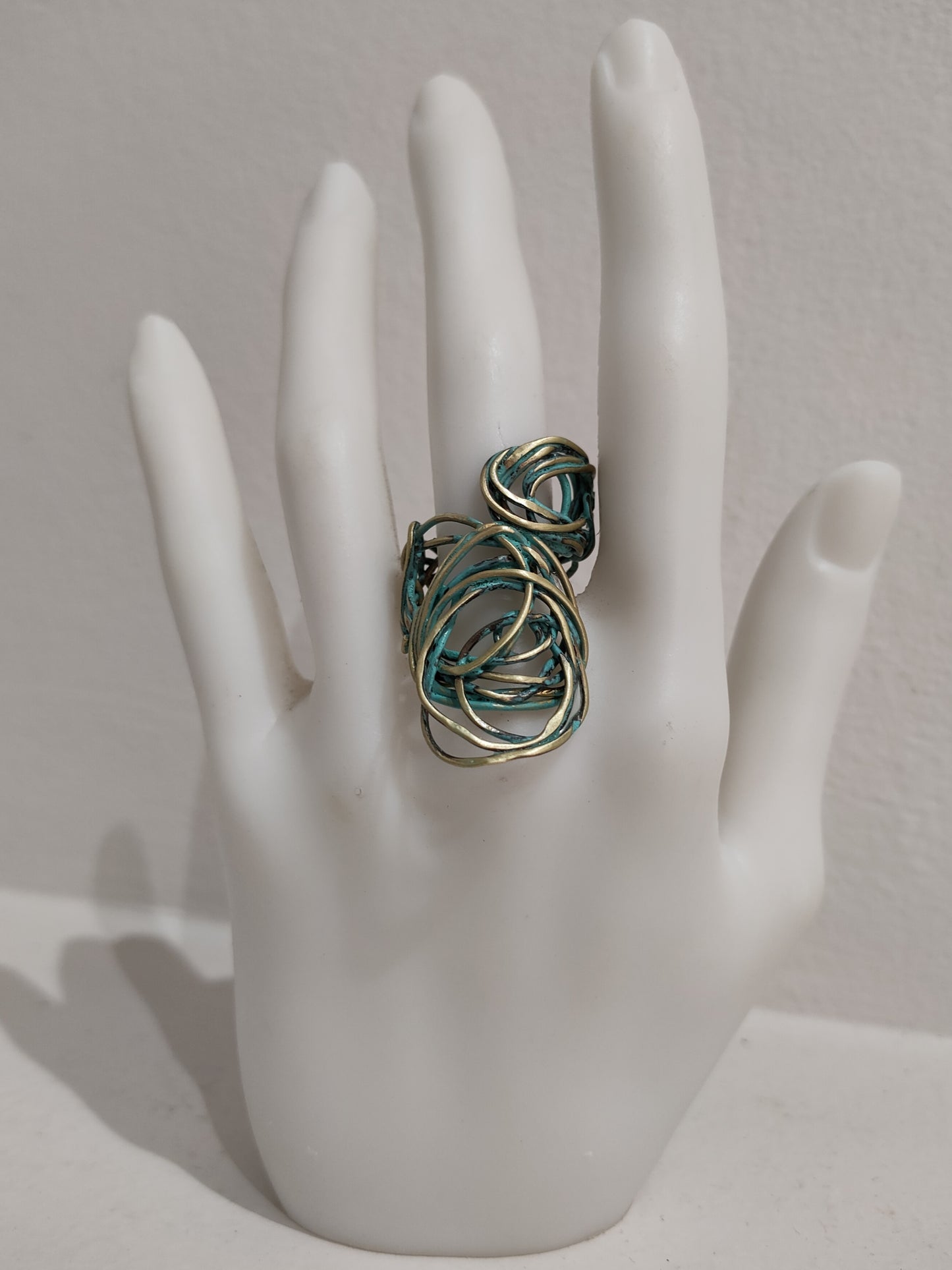 Single ring in bronze and copper with green patina